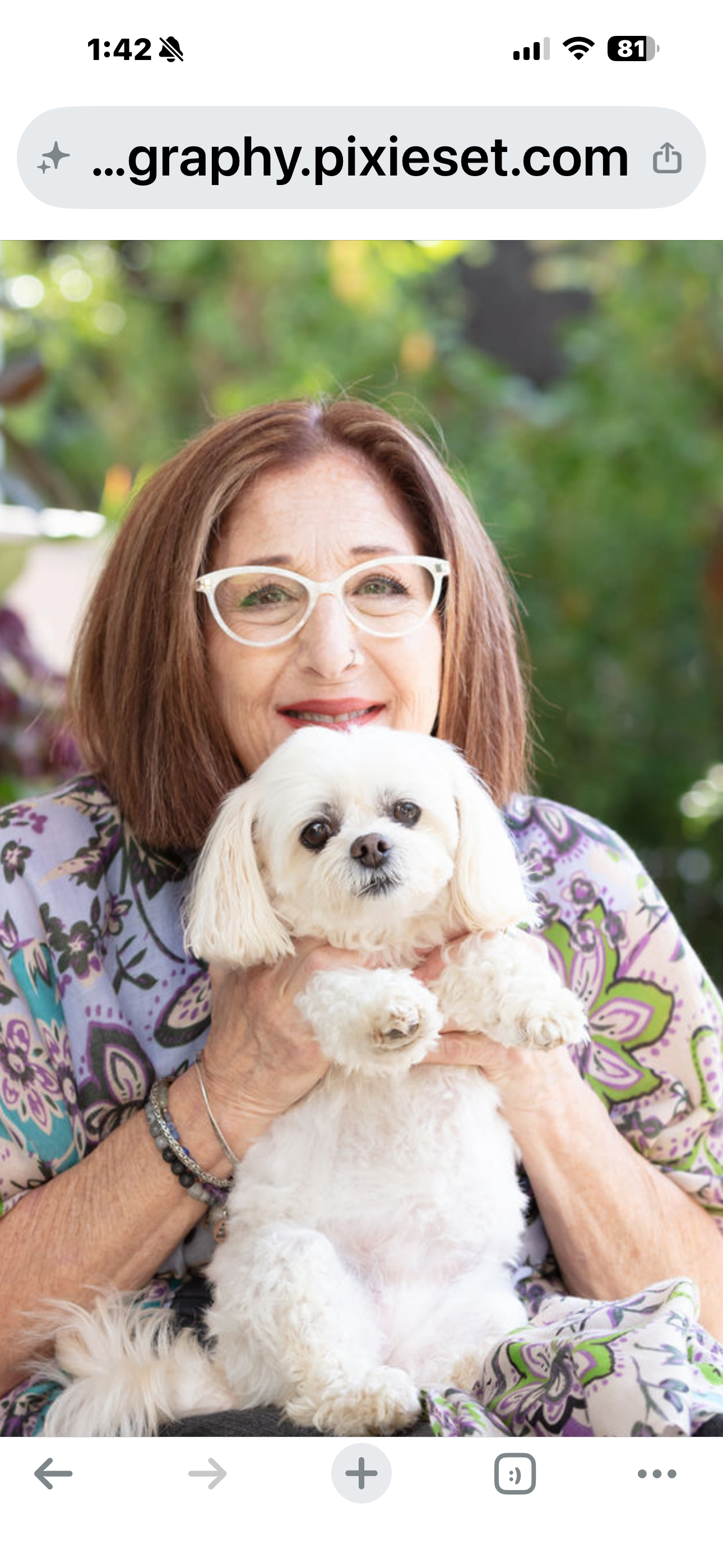 Patti Katz Black holding Sadie outdoors